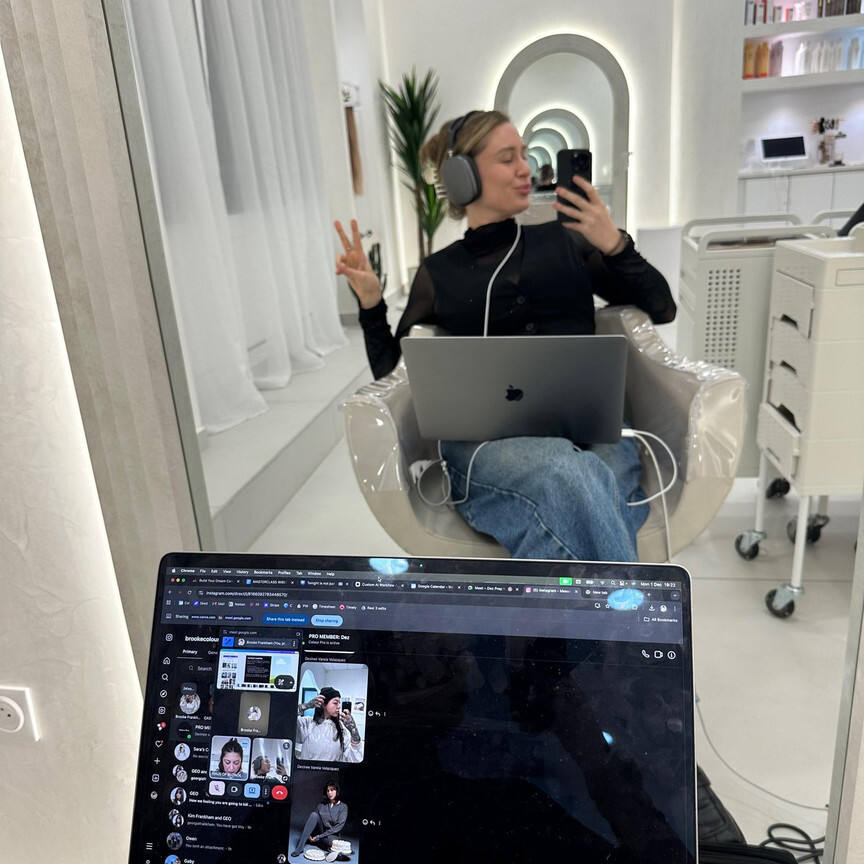 Working on a laptop in the salon